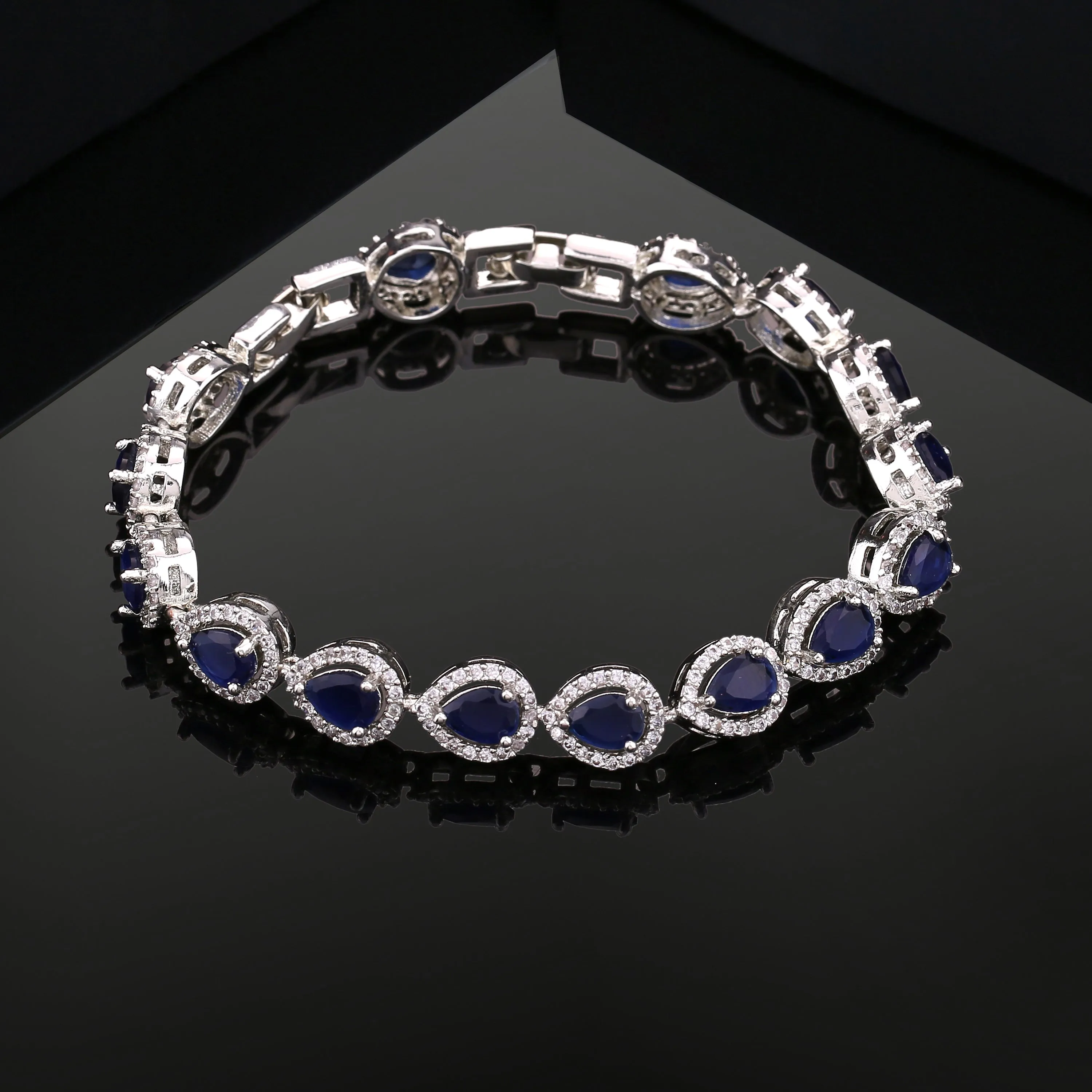 Estele Rhodium Plated CZ Drop Designer Charm Bracelet with Blue American Diamonds for Women