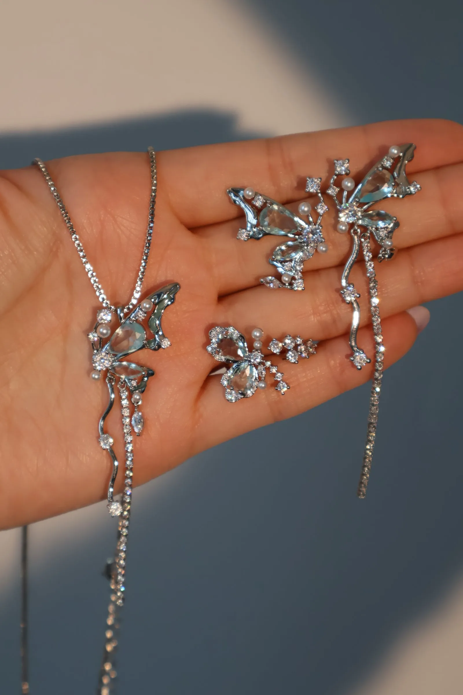 Platinum Plated Blue Gem Butterfly Earrings